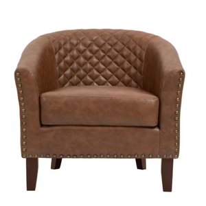 Brown leather armchair with quilted backrest and metal stud trim, supported by wooden legs.