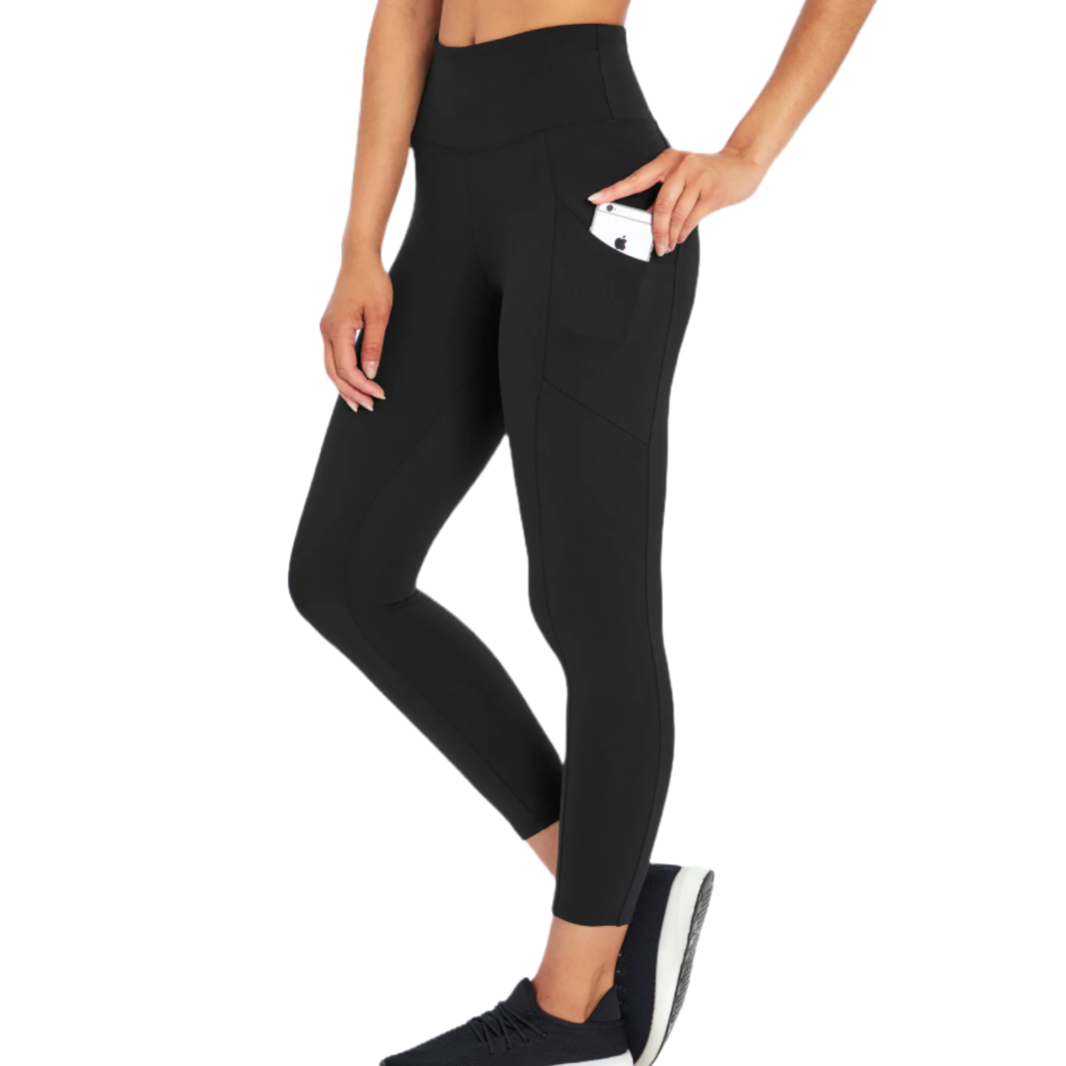Black high-waisted leggings with pockets, holding a smartphone, worn by a person paired with black sneakers.