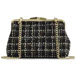 A tweed handbag with a black, white, and gold checkered pattern, featuring a gold chain strap and a metal clasp closure.