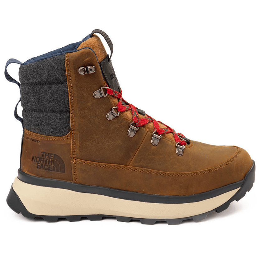 A brown leather hiking boot with red laces, quilted gray fabric around the ankle, and a black and tan sole. It features The North Face logo and \“DRYVENT\“ text on the side.