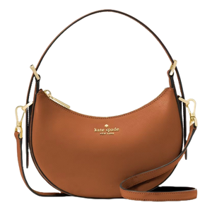 A Kate Spade New York brown-curved handbag with gold-tone hardware, featuring a top zipper and an adjustable strap.