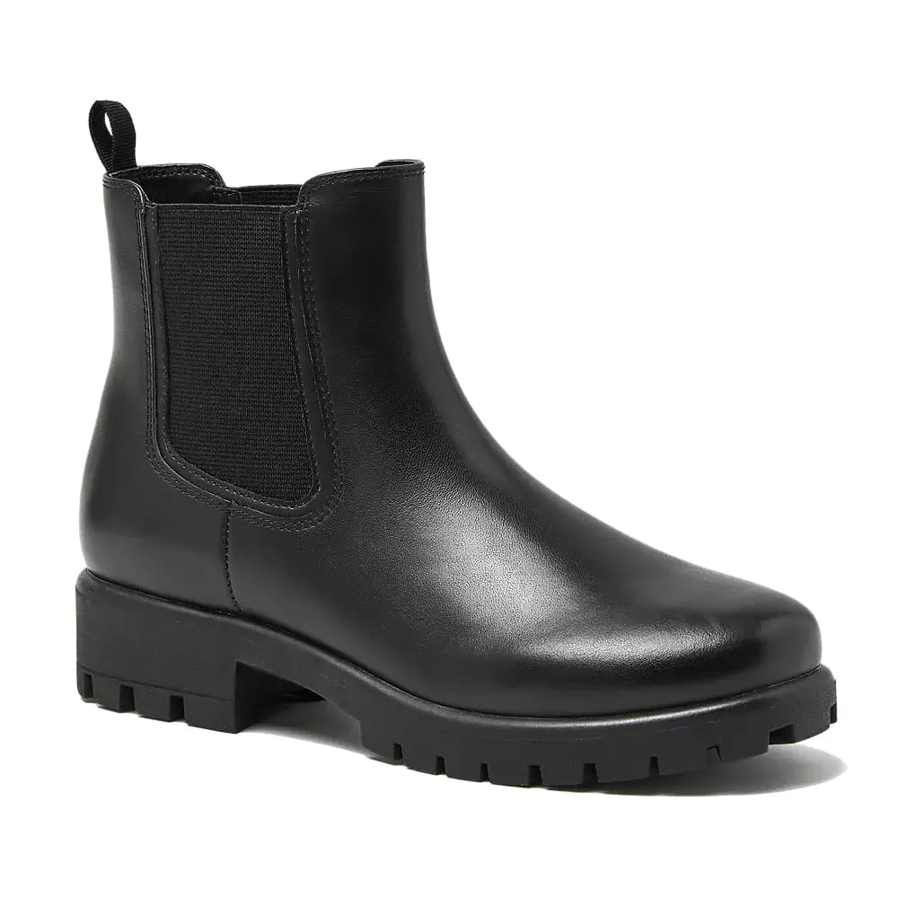 Black Chelsea boot with elastic side panels and a rugged lug sole.