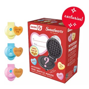 Dash Valentine Mystery Waffle Maker includes one of three mini waffle makers that create heart-shaped waffles with phrases like \“Cutie Pie,\“ \“Bestie,\“ or \“XOXO.\“