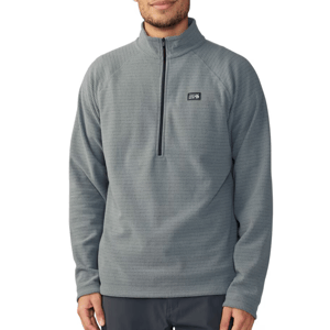 A person wearing a gray quarter-zip fleece pullover with a small logo on the left chest.