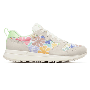 A colorful sneaker features floral patterns with suede accents, a light green heel tab, and white laces.