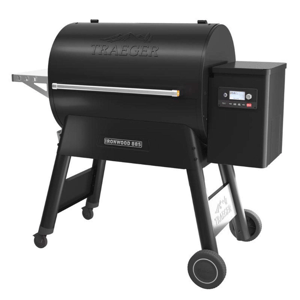 A Traeger Ironwood 885 pellet grill, featuring a black cylindrical body, digital control panel, side handle, and sturdy legs with wheels for mobility.