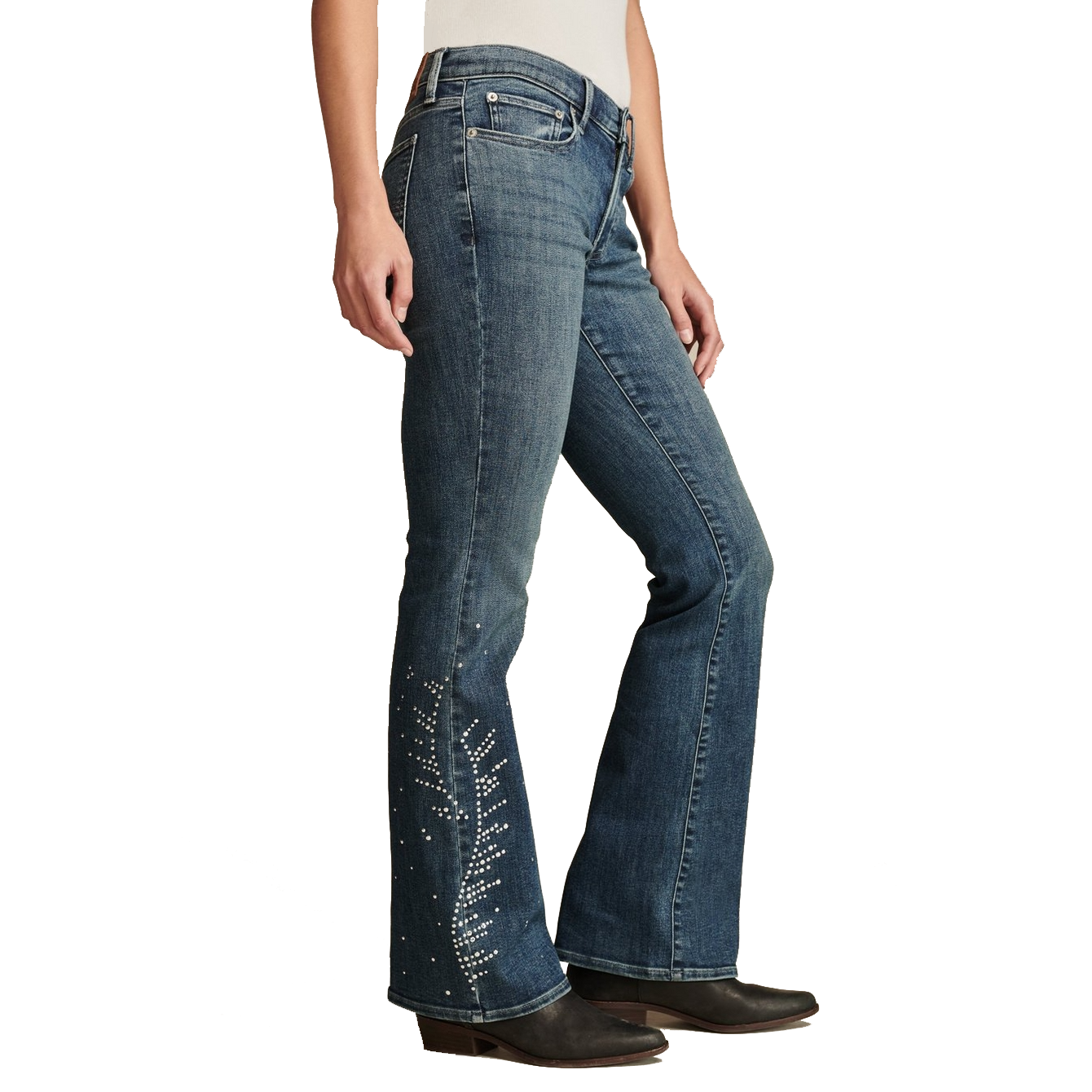 Lucky Brand Studded Flare Jeans feature a medium-wash denim with flared legs and decorative stud accents along the lower sides. They are paired with dark-heeled boots and have a classic five-pocket design.