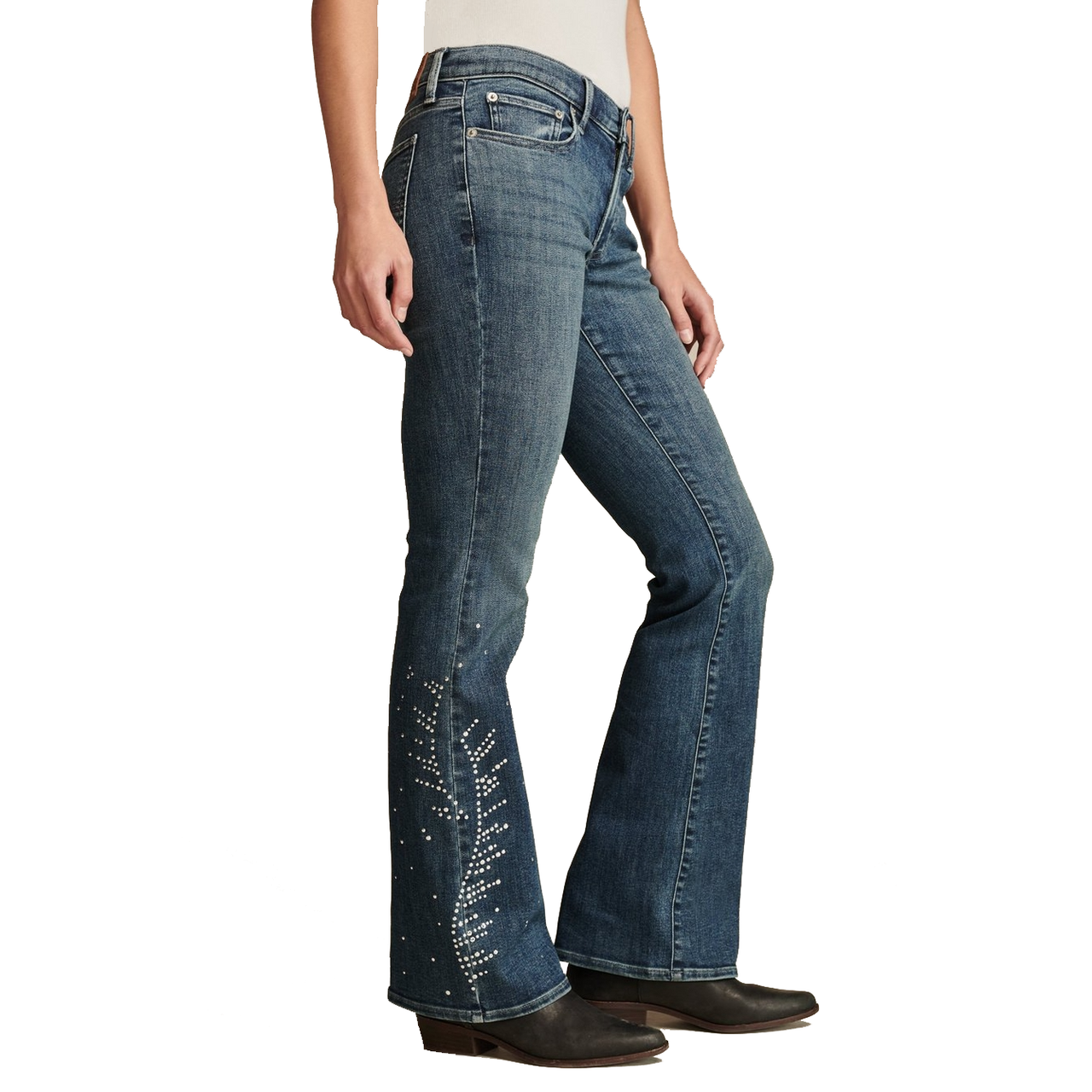 Lucky Brand Studded Flare Jeans feature a medium-wash denim with flared legs and decorative stud accents along the lower sides. They are paired with dark-heeled boots and have a classic five-pocket design.