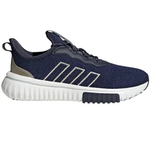 Dark blue athletic sneaker with a textured knit upper, beige heel accents, and white midsole, featuring a black outsole section and striped side design.