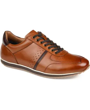 A pair of brown leather sneakers with dark laces, perforated side detailing, and a contrasting black sole.