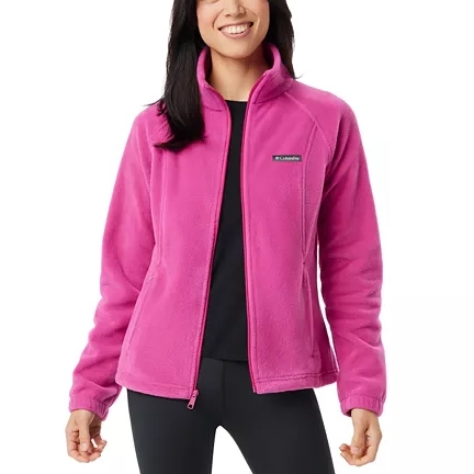 Woman wearing a pink fleece jacket with a stand-up collar and zipper front.