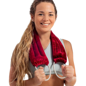 A woman with long hair is holding a maroon neck pad or wrap with two rope-like handles, wearing a light-colored sports bra.