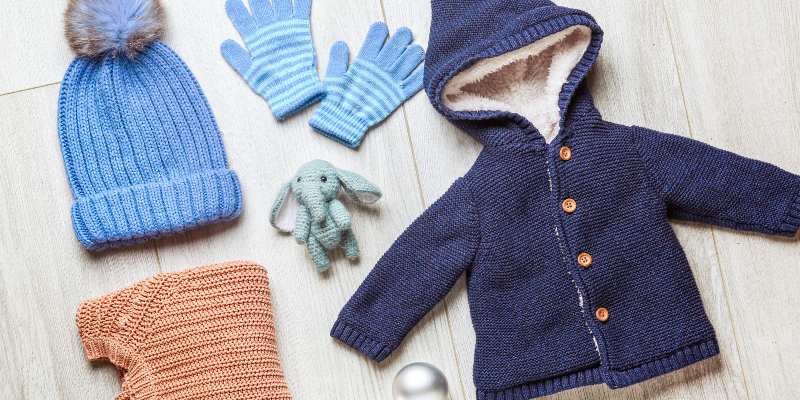 Kids winter clothing on floor 