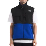 A black and blue North Face fleece vest with a high collar, zippered front, and multiple pockets, worn over a white short-sleeve shirt.