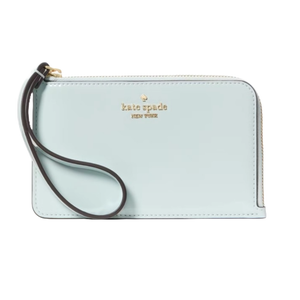Kate Spade Lucy Small L-Zip Wristlet in light blue features a gold-tone logo on the front, a wrist strap, and a zip-around closure with clean stitching.