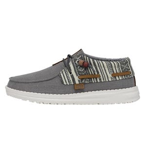 Casual shoe with a grey canvas upper, patterned textile detail, and a white sole.