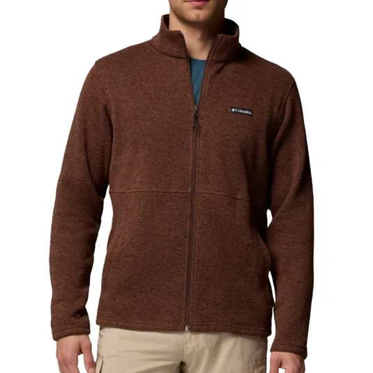 Brown full-zip fleece jacket with a logo on the chest, paired with beige pants.