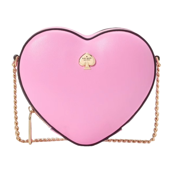 A heart-shaped crossbody bag in pink leather with a gold chain strap and a small gold spade logo on the front.