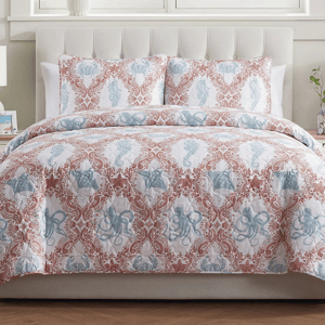 The VCNY Quilt Set features a sea life theme with blue octopuses, starfish, and seahorses against a red intricate pattern on a white background, including a quilt and two matching pillow shams.