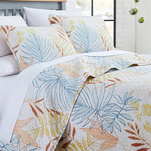 3pc Tropical Leaf Queen Quilt Set features a quilt and two pillow shams with a multicolored leaf pattern in shades of blue, yellow, and orange on a white background, offering a fresh and vibrant look.