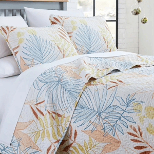 3pc Tropical Leaf Queen Quilt Set features a quilt and two pillow shams with a multicolored leaf pattern in shades of blue, yellow, and orange on a white background, offering a fresh and vibrant look.