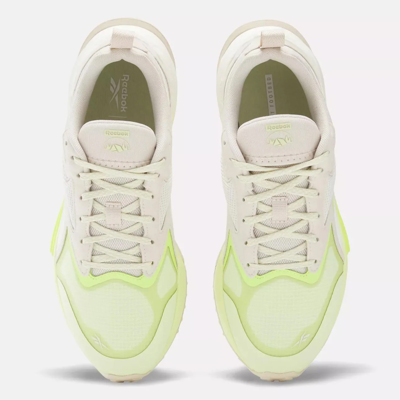 A pair of Reebok sneakers with a beige and neon yellow color scheme.