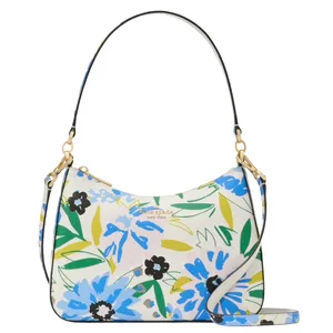 A floral-patterned Kate Spade New York handbag featuring a mix of blue, green, and yellow flowers. It has a detachable shoulder strap and gold hardware accents.