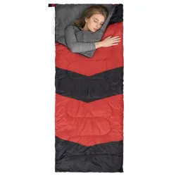 A person sleeps in a rectangular red and black sleeping bag with a gray lining.