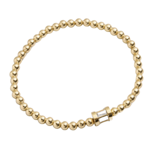 A gold beaded bracelet featuring a small, central rectangular stone, known as the Tatum Birthstone Bracelet.