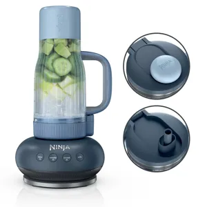 A Ninja blender with a cup containing cucumbers and ice cubes, featuring a blue lid and a control panel with buttons for blend, smoothie, ice crush, and pulse functions. Two close-up views of the lid are shown, highlighting the spout.