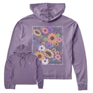 Lavender hoodie featuring a vibrant floral design and the phrase \“Positive Energy is Beautiful Energy\“ on the back, with a small circular pattern on the front.