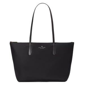 Black Kate Spade New York tote bag with long handles, featuring a minimalist design and logo on the front.