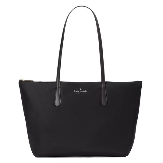 Black Kate Spade New York tote bag with long handles, featuring a minimalist design and logo on the front.