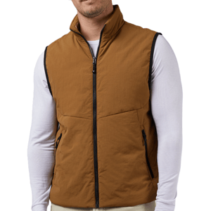 The 32 Degrees Commuter Tech Vest is a brown, sleeveless outerwear piece with a front zipper, high collar, and zippered pockets. It's worn over a long-sleeved white shirt.