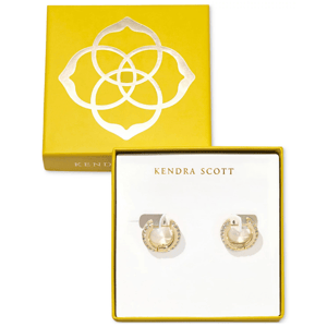 Kendra Scott Huggie Hoop Earrings feature a gold-plated design with embedded crystals, presented in a signature yellow box with a floral logo.
