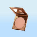 A compact with a mirror containing a pressed powder or blush in a warm, neutral tone.