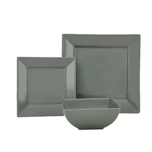 A 12-piece Food Network Dinnerware Set featuring a minimalist design with square shapes includes large and small square plates and bowls, all in a solid gray color.