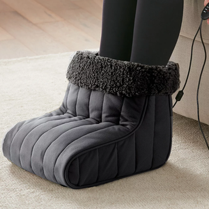 A foot warmer boot with a soft, quilted design and a fleece lining, featuring an electric cord and control for adjustable heat settings, perfect for keeping feet warm.