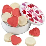 A round tin with a heart design on the lid contains frosted heart-shaped and round sugar cookies in red and white.