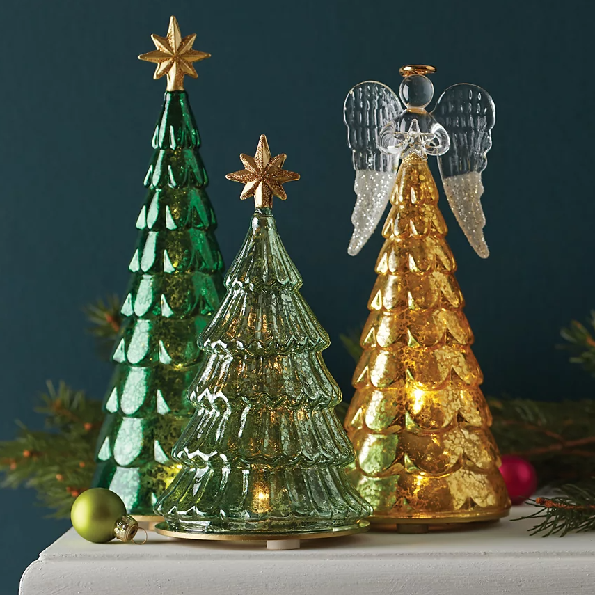 A green glass Christmas tree with an LED light feature, topped with a gold star, measuring 9 inches in height.
