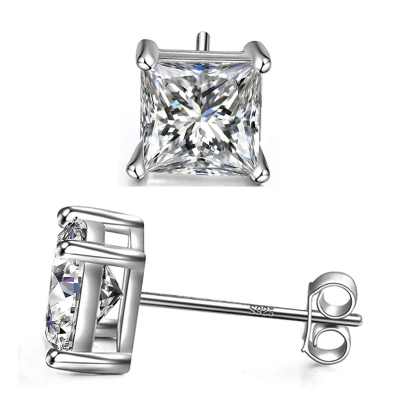 Silver square stud earrings feature a large, clear square-cut gemstone set in a four-prong setting. The post is marked with \“925,\“ indicating sterling silver.