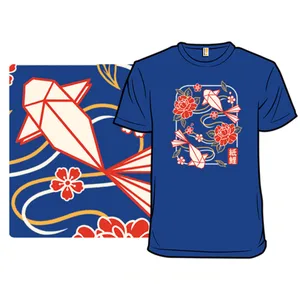 A blue T-shirt featuring an origami koi fish and floral design in red and white, with stylized waves and blossoms.