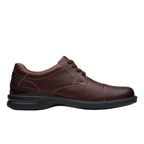 Brown leather lace-up dress shoe with a black sole, featuring detailed stitching and a classic design.