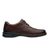 Brown leather lace-up dress shoe with a black sole, featuring detailed stitching and a classic design.