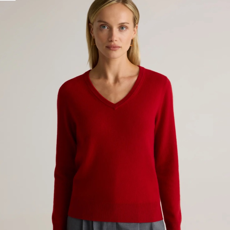 A red V-neck sweater made of Mongolian cashmere, with long sleeves and ribbed cuffs and hem.