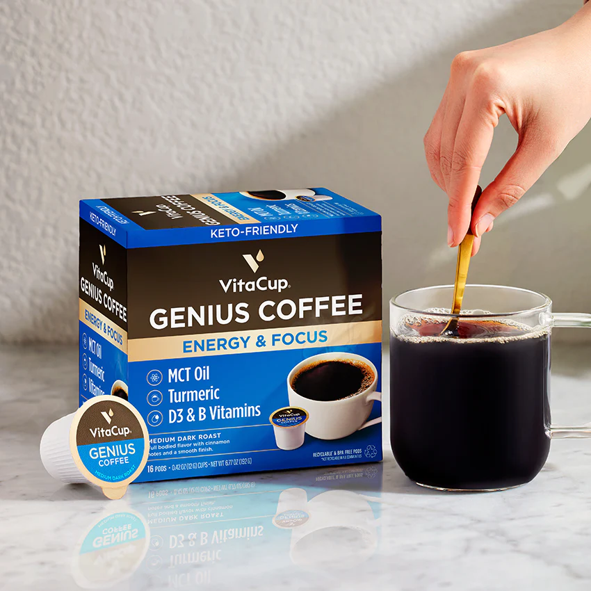 VitaCup Genius Coffee K-Cups for energy and focus, infused with MCT oil, turmeric, and vitamins D3 & B, beside a glass mug of coffee.