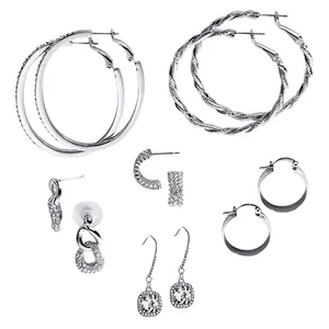 A collection of various hoop and drop earrings in silver tones, featuring different designs such as twisted hoops, textured loops, and rhinestone embellishments.