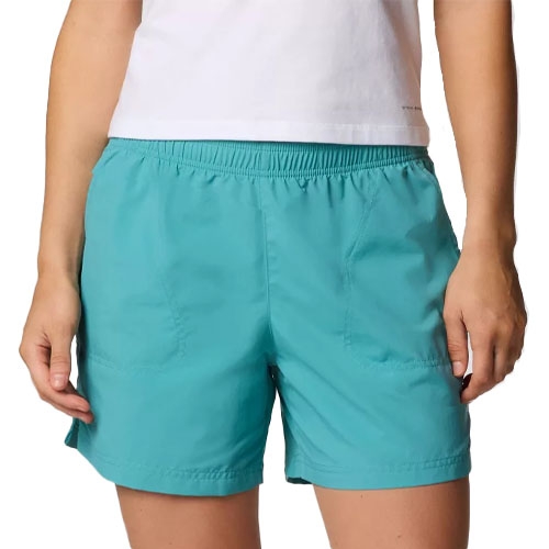 A person is wearing teal shorts with an elastic waistband and side pockets, paired with a white shirt.