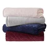 Four stacked plush blankets in pastel pink, light gray, navy blue, and burgundy, each with a subtle embossed pattern.