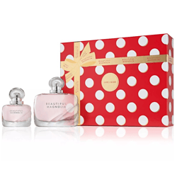 Estee Lauder Beautiful Magnolia fragrance set includes two bottles, one larger and one smaller, packaged in a red, polka-dotted gift box with a gold ribbon.